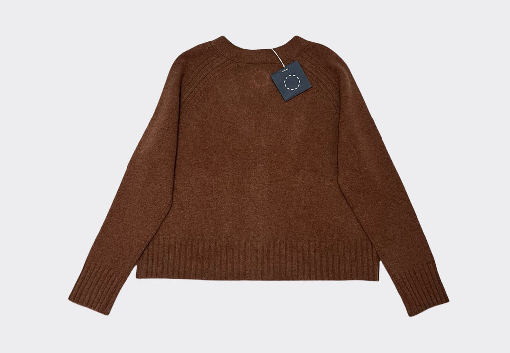 Back product flat lay of boxy hazelnut brown cashmere cardigan with ribbed detailing. Swing tag visible and circle of stitches logo from Irish knitwear brand Sphere One