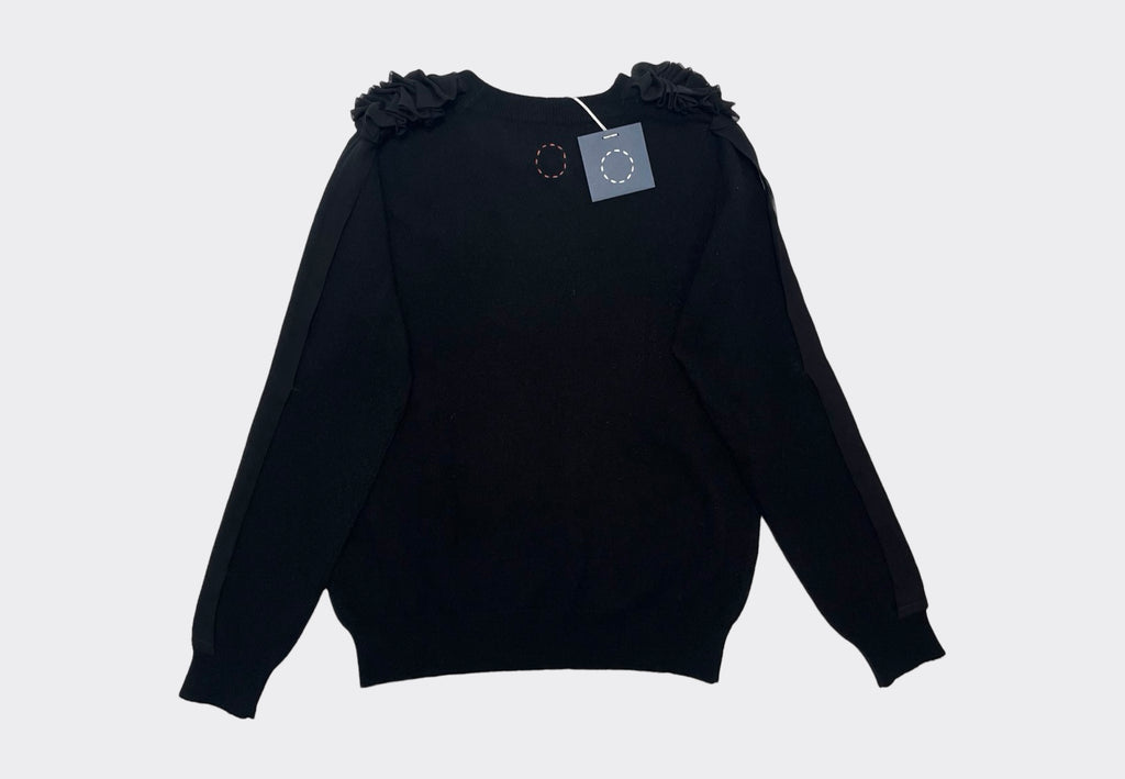 Back product shot of black cashmere Sphere One Capillary sweater with black ruffle chiffon shoulder and arm detail