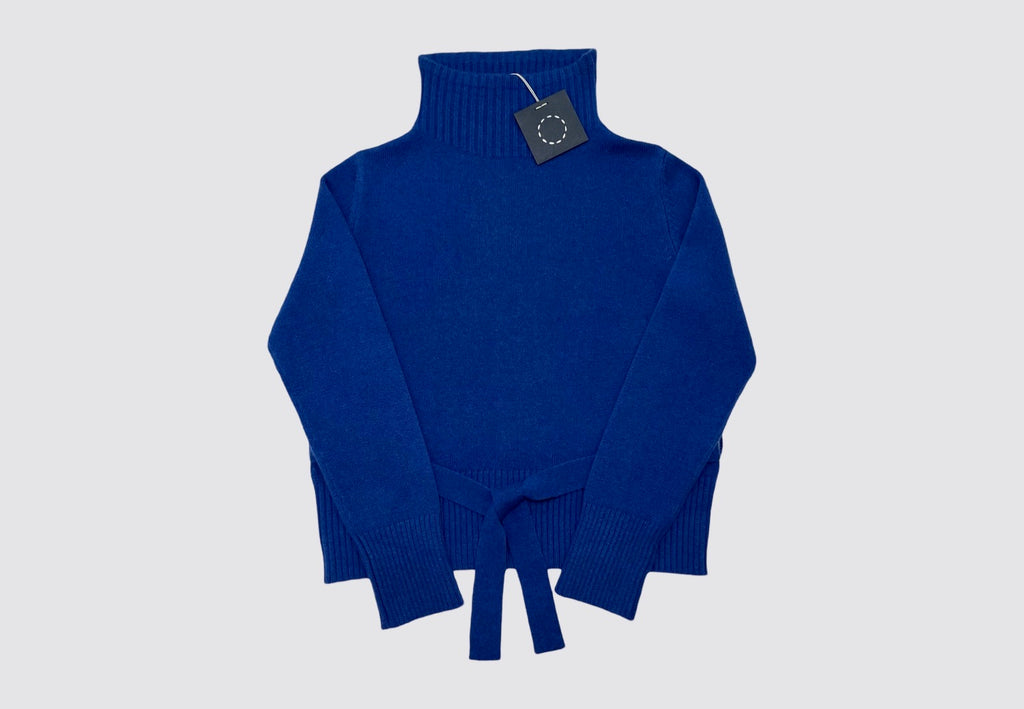 Flat lay front of a bright blue belted cashmere turtleneck