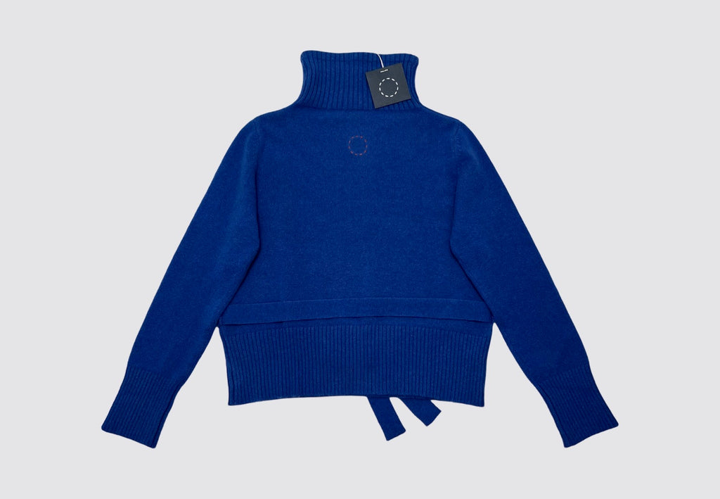 Flat lay back of a bright blue belted cashmere turtleneck with rib him and cuffs and neck